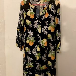 Crown and ivy knee length dress with three-quarter sleeves, crocheted arms.